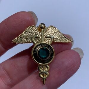 Respiratory Care Practitioner gold tone and faux emerald lapel 1.5” pin